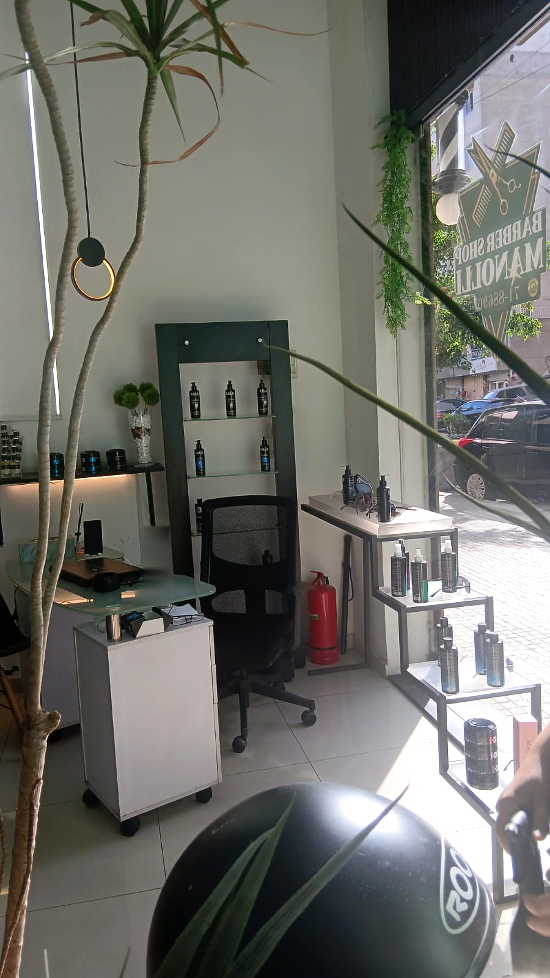Reception desk and product shelving by the front window